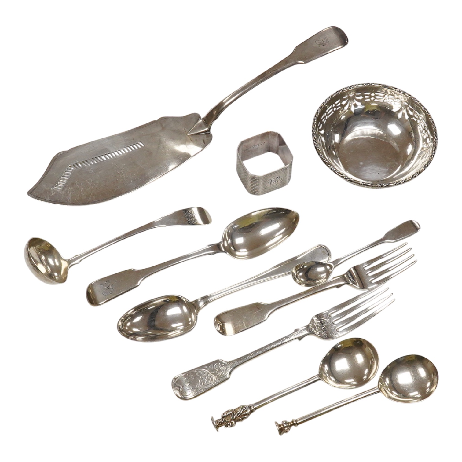 Eight assorted items of 19th century and later silver flatware including a Georgian silver fish slice(repair), various dates and makers, together with a Danish white metal spoon, a silver napkin ring and a small pierced